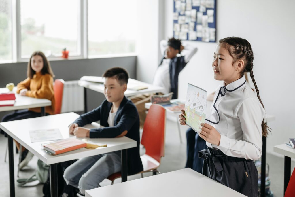 Students in a classroom engaging during a presentation, emphasizing education and learning.